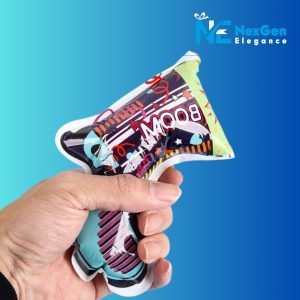 Close-up of a hand holding a colorful Party Popper Air Blaster toy gun with BOOM text and abstract blue, purple, and green patterns, NexGen Elegance logo top right.