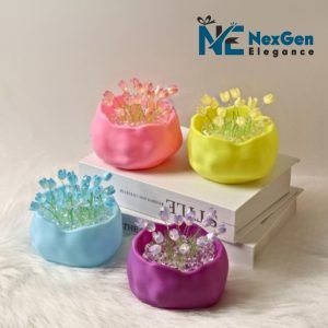 Vibrant miniature potted plants with glowing tulip-shaped flowers in pink, yellow, blue, and purple on stacked books, soft blurred background, NexGen Elegance logo