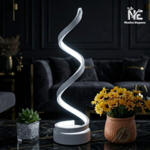 Modern white spiral desk lamp with bright LED light on a marble table.