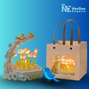 Tulip Bird Glow Night Light with orange glowing flowers, next to gift bag packaging, ceramic LED decorative lamp for gifting