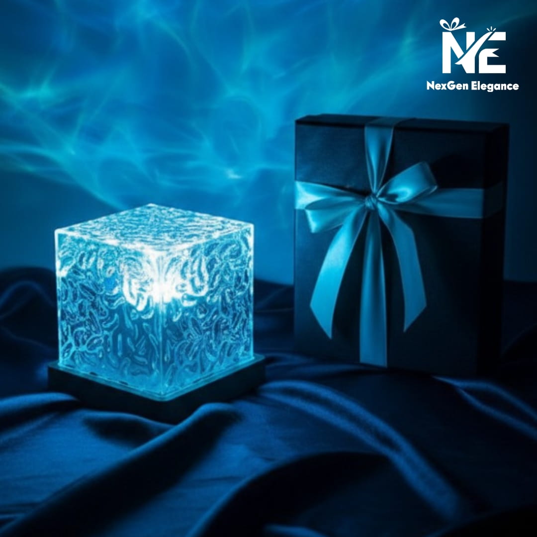 A blue water ripple projector lamp placed next to a premium black gift box with a silk ribbon.